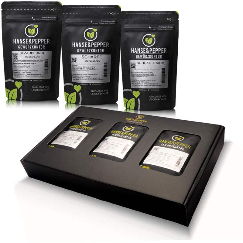 Geschenkbox mit Produkttüten, gefüllt mit Bezaubernder Schokolade, Scharfer Schokolade und Schoko Traum.